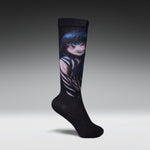 A single black crew sock with a detailed graphic print of an anime-style girl with long dark blue hair, shown against a dark gray gradient background.