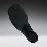 A black shoe sole shown floating against a gradient gray background.
