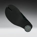A black split-toe shoe sole with a textured surface and a translucent gray decorative end cap, shown on a dark-to-light gray gradient background.