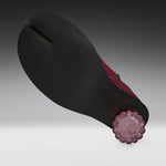 A traditional Japanese tabi-style foot strap shoe shown from the sole side, featuring a wide matte black foot strap with a central seam, a deep burgundy red inner lining, and a translucent purple flower-shaped end cap.