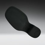A black textured shoe sole with visible stitching and molded tread details, shown floating against a dark-to-light gray gradient background.