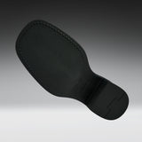 A black textured shoe sole with visible stitching and molded tread details, shown floating against a dark-to-light gray gradient background.