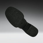 A close-up of a black textured shoe sole, shown floating against a gradient gray background.