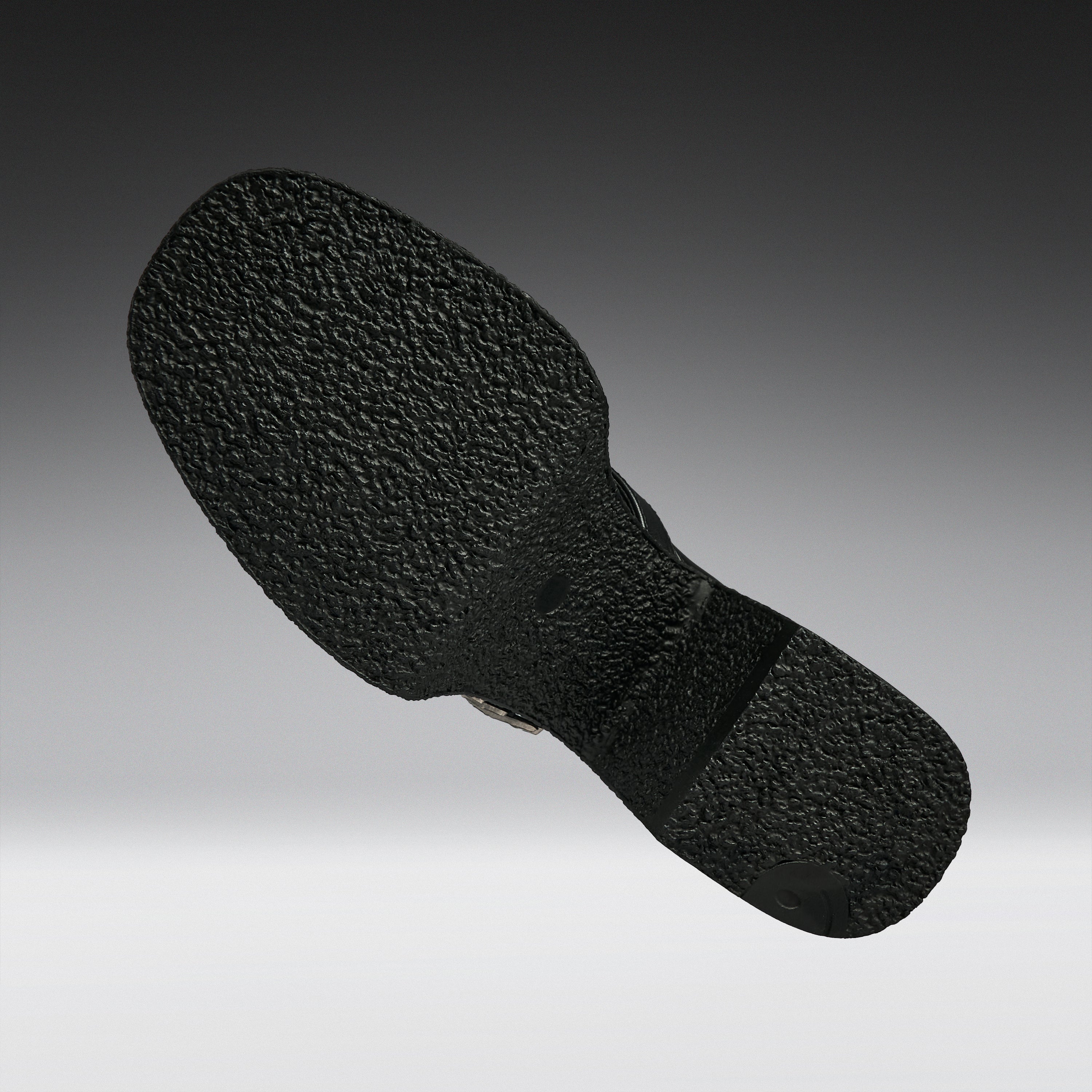 A close-up of a black textured shoe sole, shown floating against a gradient gray background.