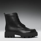 A single black leather lace-up ankle boot with a chunky lug sole, shown in a side profile against a dark gray to light gray gradient studio background.