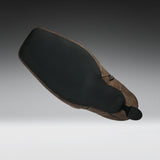 A motorcycle or bicycle leather saddle with a black textured rubber seat pad and a brown leather body, shown floating against a gradient gray background.