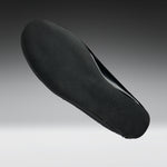 A black shoe insole shown floating against a gradient gray background.
