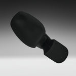 A black textured headrest or support cushion with a curved top section and a rectangular base, shown floating against a dark-to-light gray gradient background.