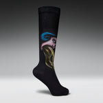 A single black crew sock with a surreal graphic print of a face with blue hair and a green snake, shown against a gray gradient studio background.