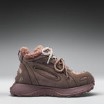 Brown winter boot with fur lining on a gray background