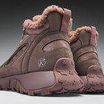 Brown winter boots with fur lining on a gray background